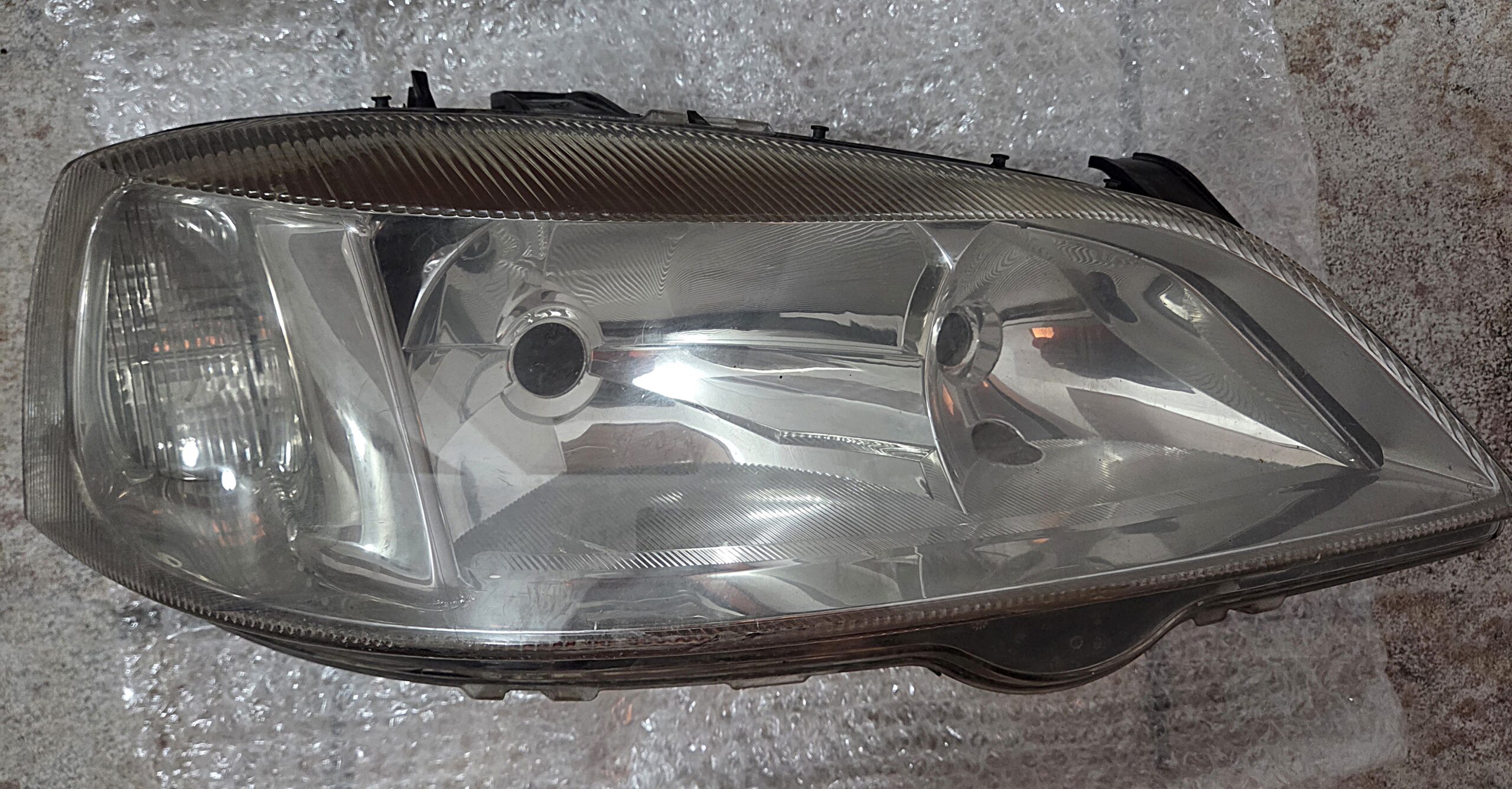 Μπροστινό γνήσιο δεξιό φανάρι για OPEL ASTRA